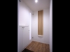 ホワイトとベージュが基本の部屋の玄関